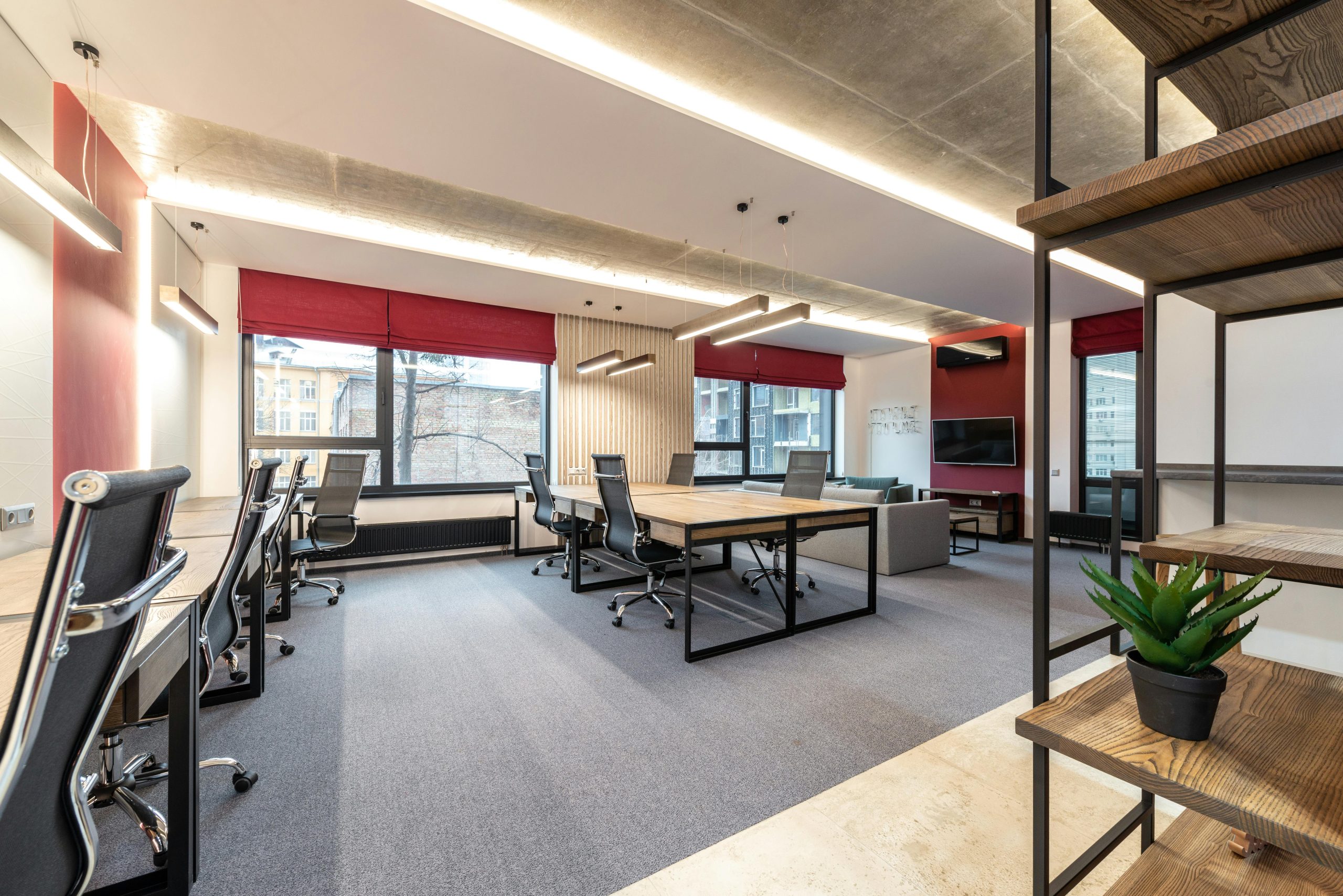 Spacious and contemporary office interior with natural lighting and minimal decor.